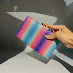 Glitter rainbow clutch bag detail, sparkling sequin evening bag, stylish party purse design.