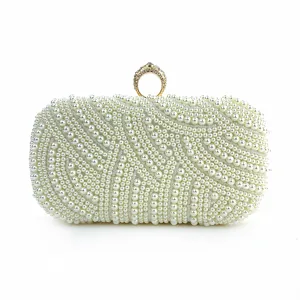 Detailed view of the elegant pearl evening clutch with a sparkling rhinestone ring clasp.