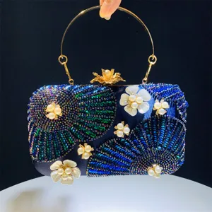 Elegant dark blue evening clutch bag with sparkling sequins, pearls and gold round handle.