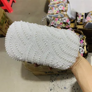 White pearl evening clutch bag with sparkling rhinestone ring clasp for women party wedding dress.