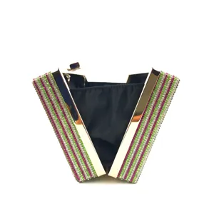 Exquisite rhinestone evening clutch detail, featuring vibrant striped crystals and metallic frame.