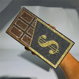 Rhinestone dollar sign and chocolate design women clutch bag detail showcase display.