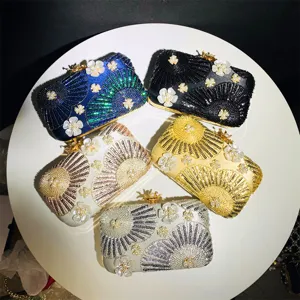 Detailed view of exquisite evening clutches featuring shimmering sequins and pearl designs.