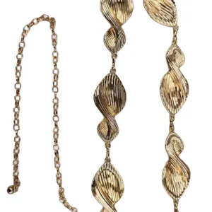 Gold metal chain belt for women, twisted leaf link waist accessory, fashion stylish chic.