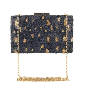 Sac pochette de soirée noir et doré à sequins avec bandoulière chaîne métallique élégant.