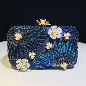 Elegant beaded evening clutch bag with flower pearl details, perfect for weddings and banquets.