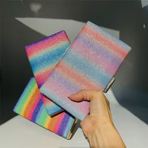 Glitter rainbow clutch bag for women, stylish sparkling evening bag with metal frame.