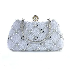 Elegant white beaded evening clutch bag with handmade floral design for wedding parties.