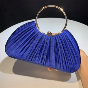 Blue satin pleated evening clutch bag with metal ring handle for party prom dress accessory detail