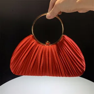 Red satin pleated evening bag with gold round metal handle for party and wedding events