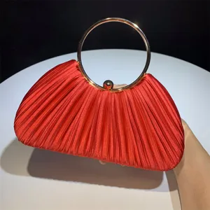 Red pleated satin evening clutch bag with metal round handle for women party wedding.