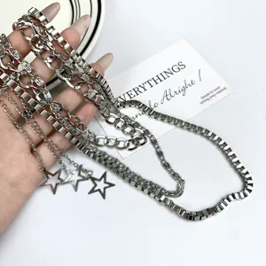 Cyberpunk multi-layer metal waist chain detail shot with star pendant silver finish.