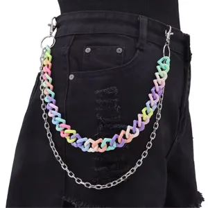 Detail shot of multi-layer hip hop pant chain featuring pastel acrylic and silver metal links.