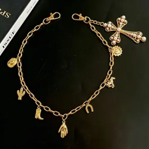 Gold pearl cross charm pants chain punk hiphop accessory detail view, stylish metal waist chain.