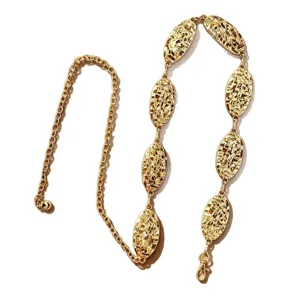 Gold tone metal waist chain featuring irregular hollow oval links and delicate link chain style.