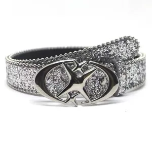 Y2K subculture women glitter belt with stylish cross star metal buckle rolled up on white base.