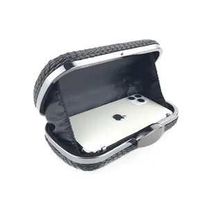 Detailed view of the black woven PU evening clutch bag with metal frame showing phone capacity.