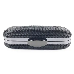 Detail view of the black woven PU clutch bag, featuring elegant metallic frame and evening style.