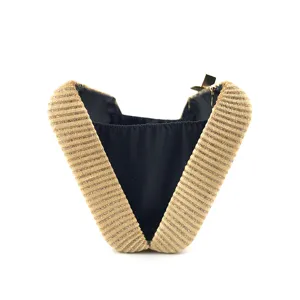 Elegant gold shimmer evening clutch bag with ribbed velvet texture and sleek black inner lining.