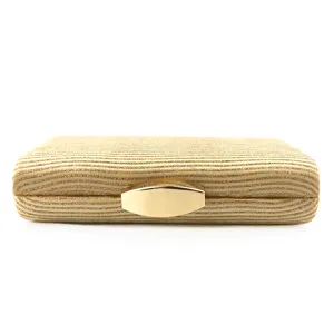 Gold glitter evening clutch bag detail view, elegant metallic clasp dress handbag for women.