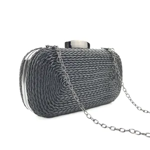 Elegant black woven clutch bag with metallic chain and clasp, perfect for evening parties.