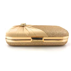 Stunning gold evening clutch bag with glitter finish and elegant pleated satin detailing.
