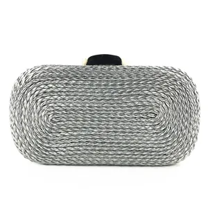 Detailed view of the silver woven PU clutch bag texture, showing exquisite craftsmanship and clasp.