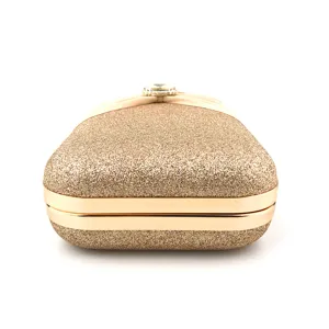 Close-up detail of the sparkling glitter evening clutch bag showing its metal frame and gem clasp.