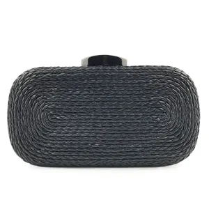 Detailed close-up of black woven PU clutch bag texture and metal clasp for women evening.