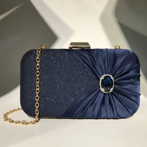 Dark blue evening clutch bag, pleated satin, glitter texture, rhinestone buckle, gold chain.