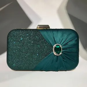 Detailed close-up of dark green glitter evening clutch with pleated satin and gem rhinestone.