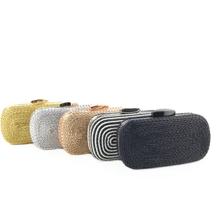 Detailed close-up of woven clutch evening bags in various colors showing fine craftsmanship.