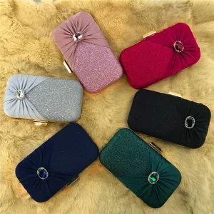 Detailed view of elegant evening clutches with sparkling rhinestones and glitter finish.