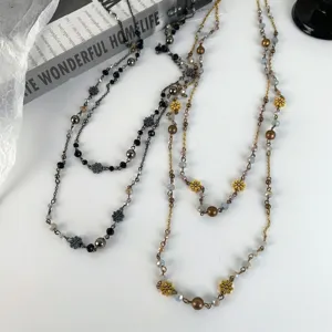 Vintage bohemian style double layered beaded waist chain and necklace detail shot.