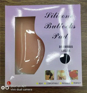 Détail de l'emballage du coussin de hanche en silicone montrant la fenêtre et la taille L.