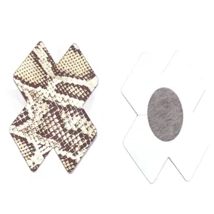Detail view of X-shaped snake printed pasties showing front pattern and sticky back.