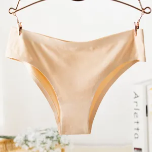 Seamless ice silk women briefs apricot color underwear fabric texture close up detail view