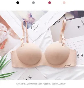 Detail shot of seamless wireless push-up bra in nude color with vertical stripes design.