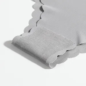 Women's seamless ribbed briefs with scalloped edges, comfortable low-waist design in grey.