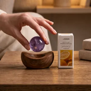 Natural crystal ball aromatherapy set with wooden base and essential oil gift box for decor.