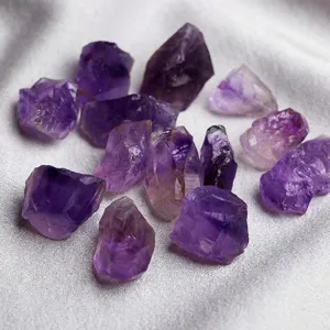 Natural raw amethyst crystal stones detail, ideal for home decoration, aromatherapy, and healing.