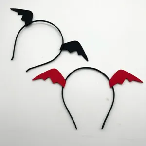 Close details of Halloween bat wing headbands in black and red, showing felt wings.
