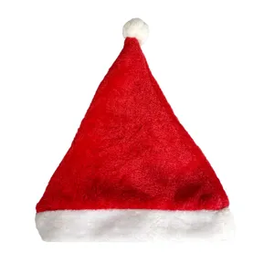 Klassische rote Pluesch Weihnachtsmütze mit weissem Rand und Pompon fuer die Feiertagsfeier.