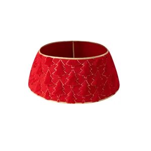 Red velvet Christmas tree collar with gold trim and textured trees for holiday party decor.