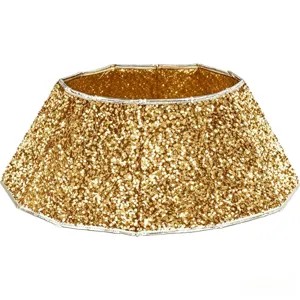 Jupe de sapin de Noel pailletee d'or pour la decoration de fete et le decor de Noel.