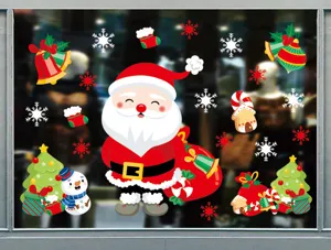 Détails d'autocollants de fenêtre de Noël avec des autocollants festifs de Père Noël.
