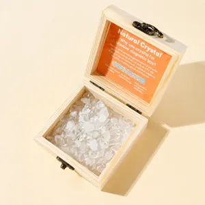 Clear glass window wooden box with natural white crystal gravel for crystal cleaning and storage.