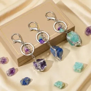 Natural raw crystal stone keychains with silver plated edges, stylish bag charm and accessories.