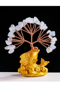Close-up detail of the crystal money tree and golden koi fish base craftsmanship.