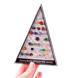Caja de muestras de minerales de cristal natural con piedras preciosas en bruto.